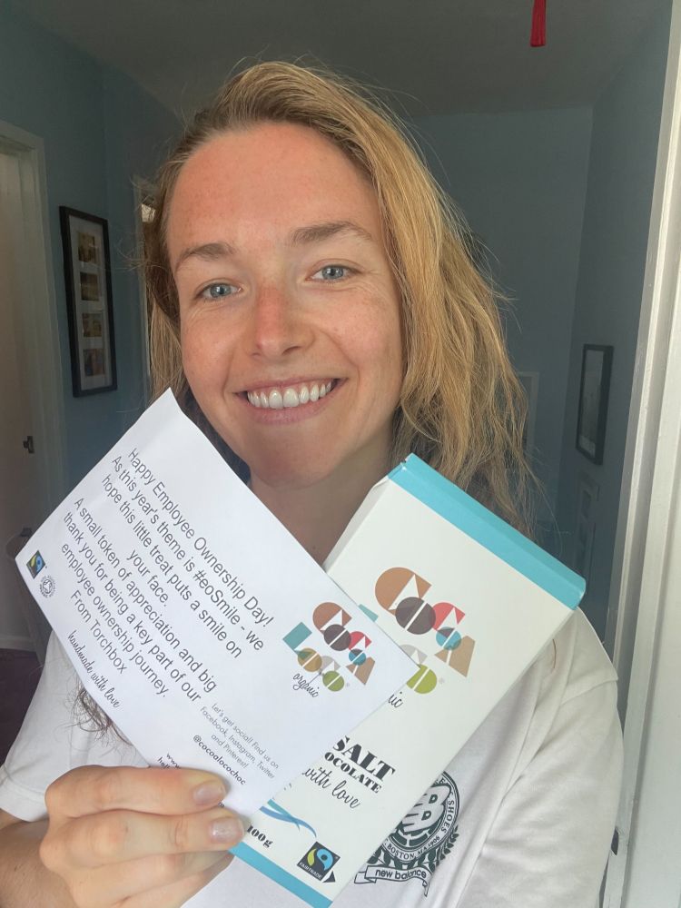 Alice holding her bar of chocolate, with a note that reads: Happy Employee Ownership Day!
As this year's theme is #eoSmile - we hope this little treat puts a smile on your face.
A small token of appreciation and big thank you for being a key part of our employee ownership journey.
