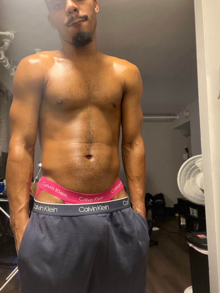 Me posing with a headless shot in Calvin Klein pajamas with pink jockstrap exposed 