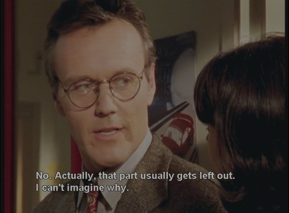 Robia Scott as Jenny Calendar and Anthony Stewart Head as Rupert Giles in Buffy the Vampire Slayer