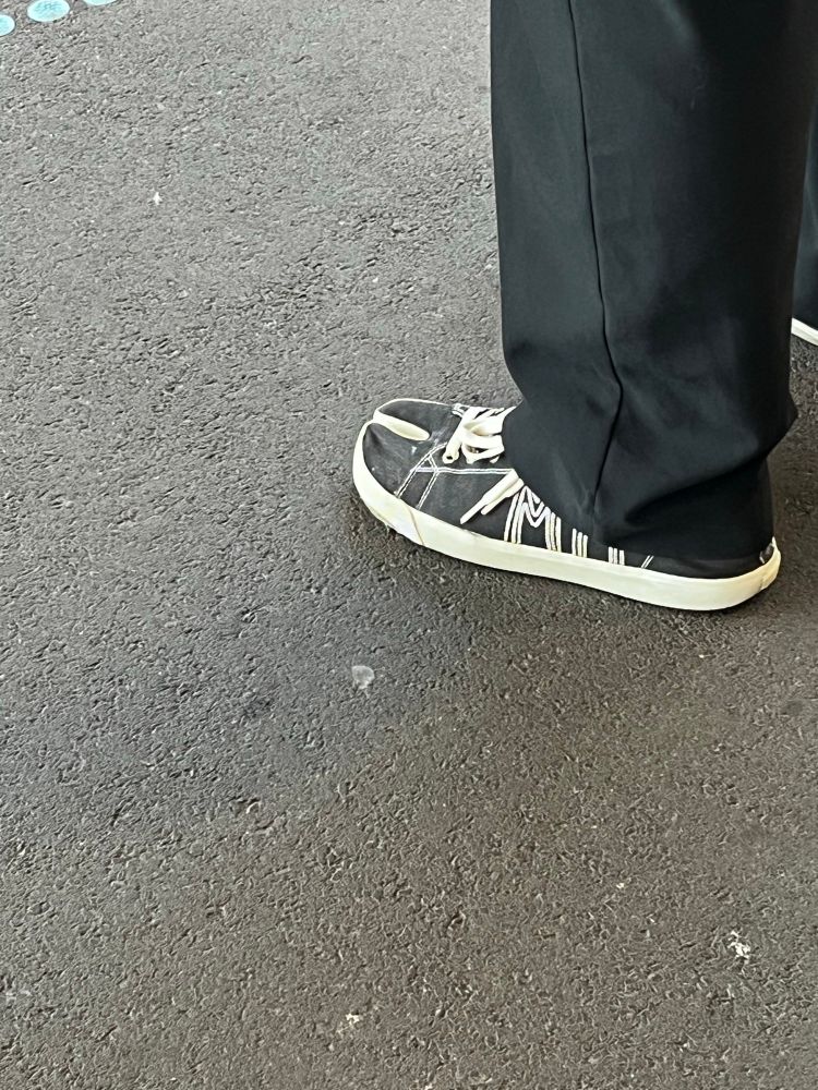 A shoe with a cut out section between the toes