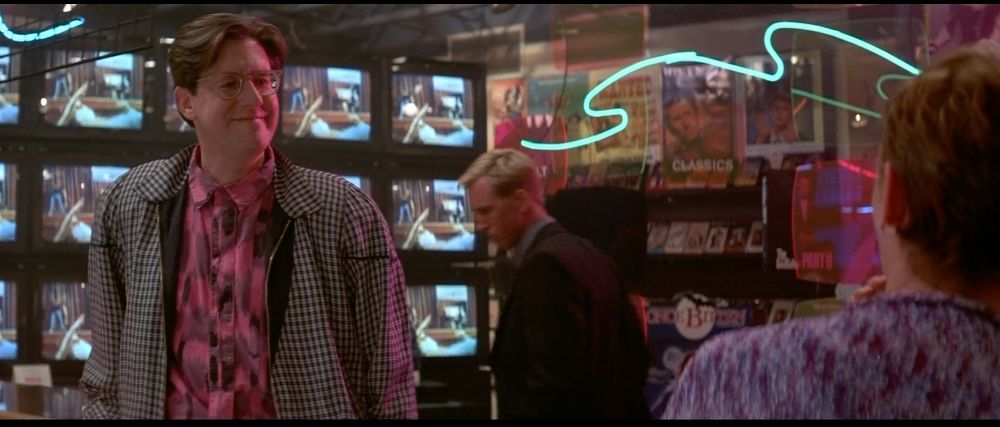 Max greets Lucy at his video store