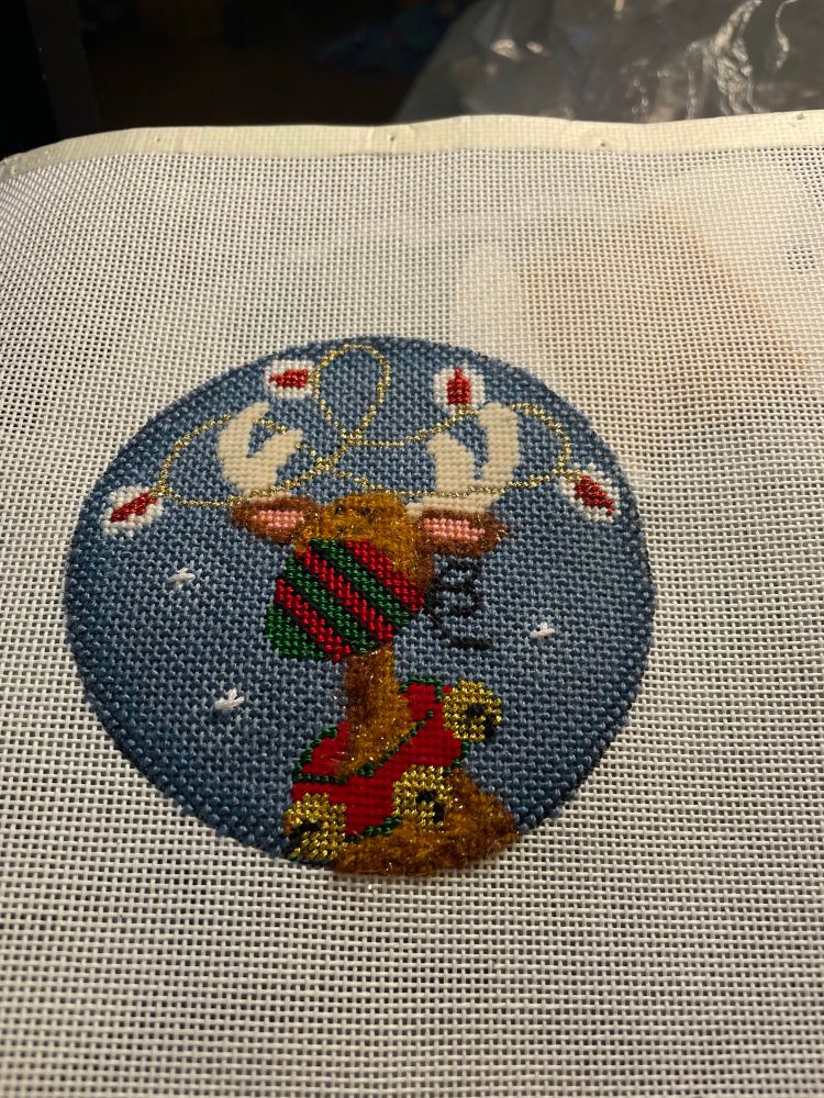 Needlepoint reindeer with a Covid mask