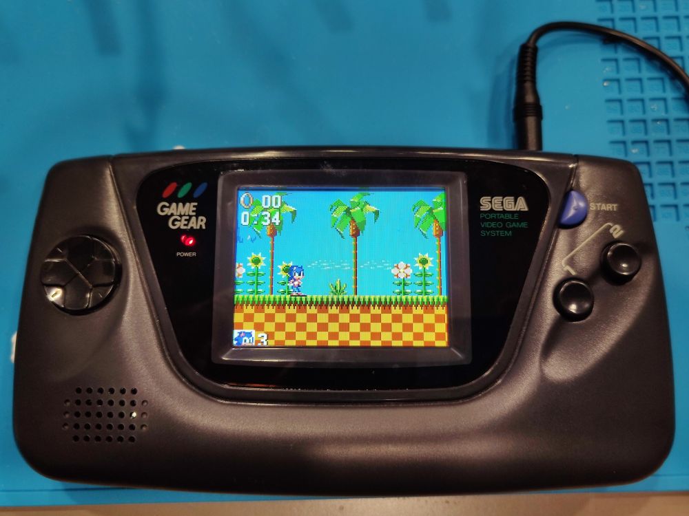Sega Game Gear va0 with replacement IPS screen playing Sonic the Hedgehog 1.