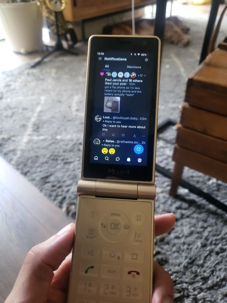 Retro flip phone running android, bluesky is open on it