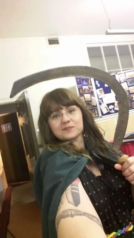 Me holding a ritual sickle many years ago