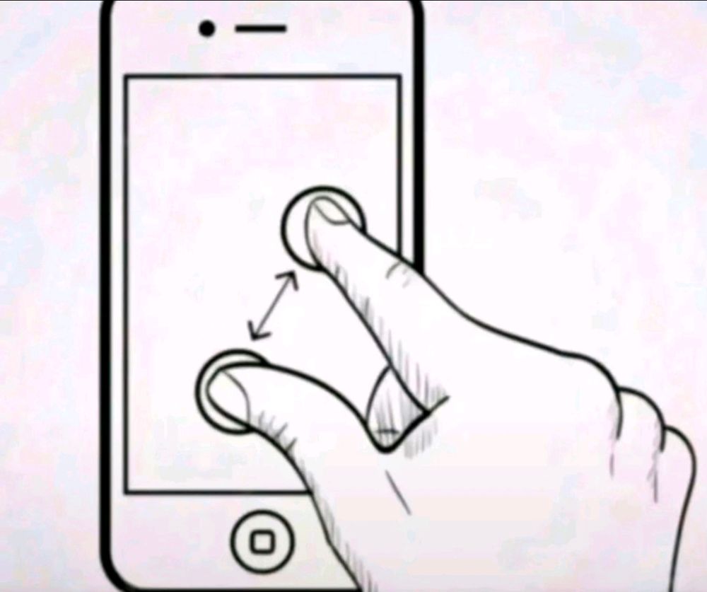 An image of two fingers zooming in on a phone screen