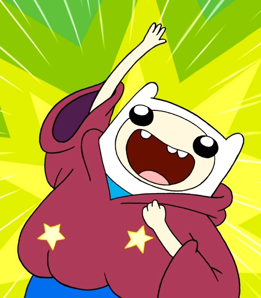 Finn has big eyes and punches the air in excitement.