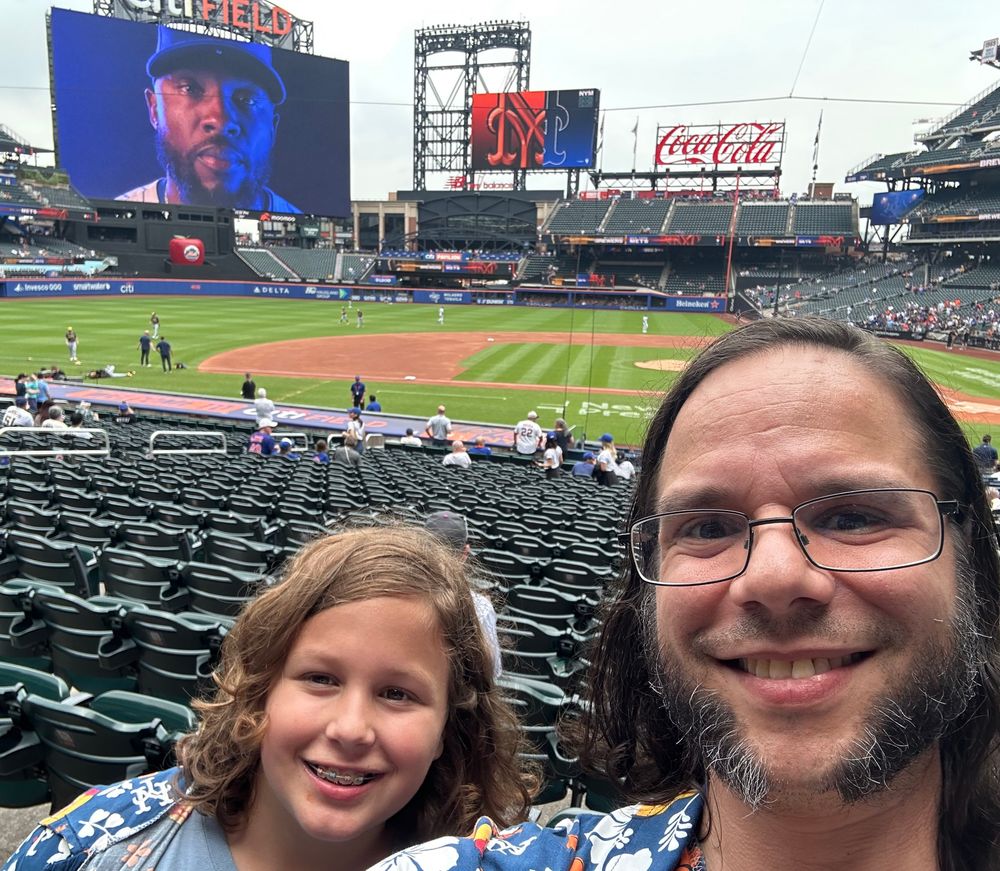 A father and son at a Mets game