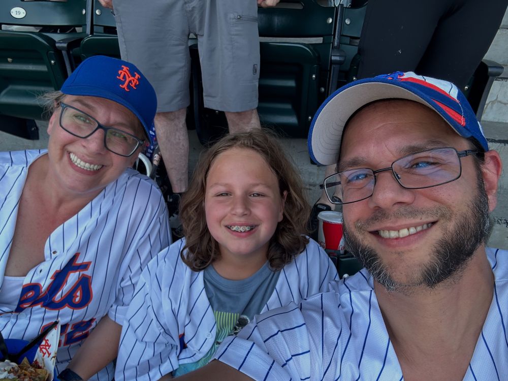 A family of three at a Mets game 