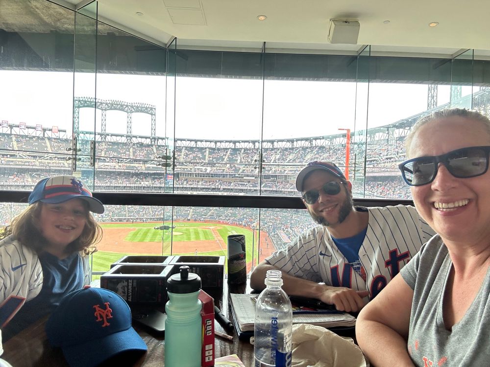 A family of Mets fans enjoying the game from the Metro market