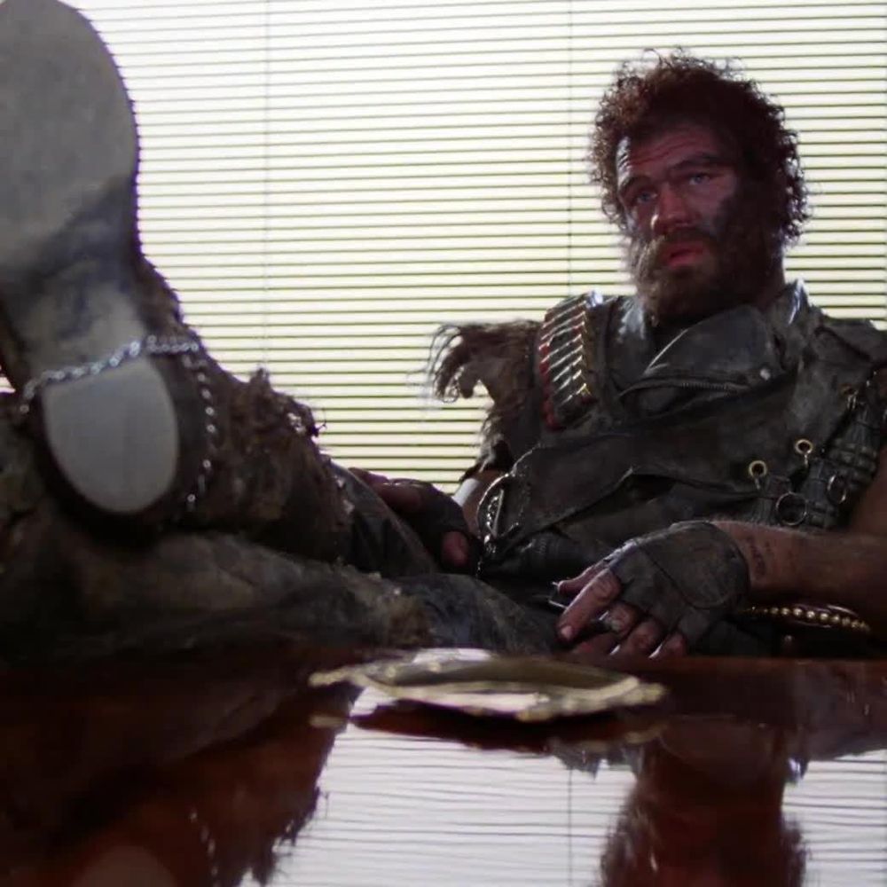 Tough guy in an office, boots on desk.

Still shot from "Arizona Junior"