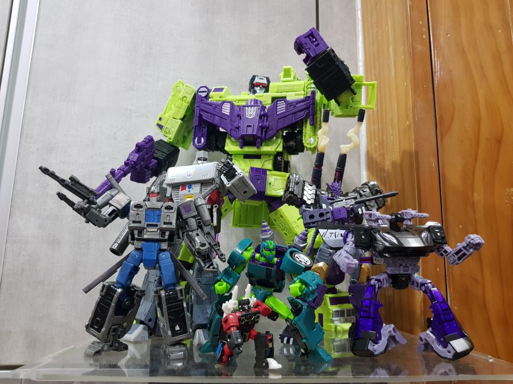 From left to right:
- AotP Vortex
- SS86 Megatron
- SS86 Devastator
- SS86 Frenzy
- AotP Wasp
- Legacy Tarn
- WfC Barricade