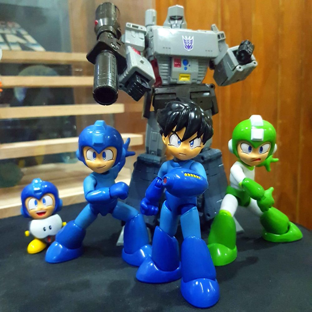 Jada Toys Mega Man, Helmetless Mega Man + Metool, Hyperbomb Mega Man and Studio Series 86 Megatron