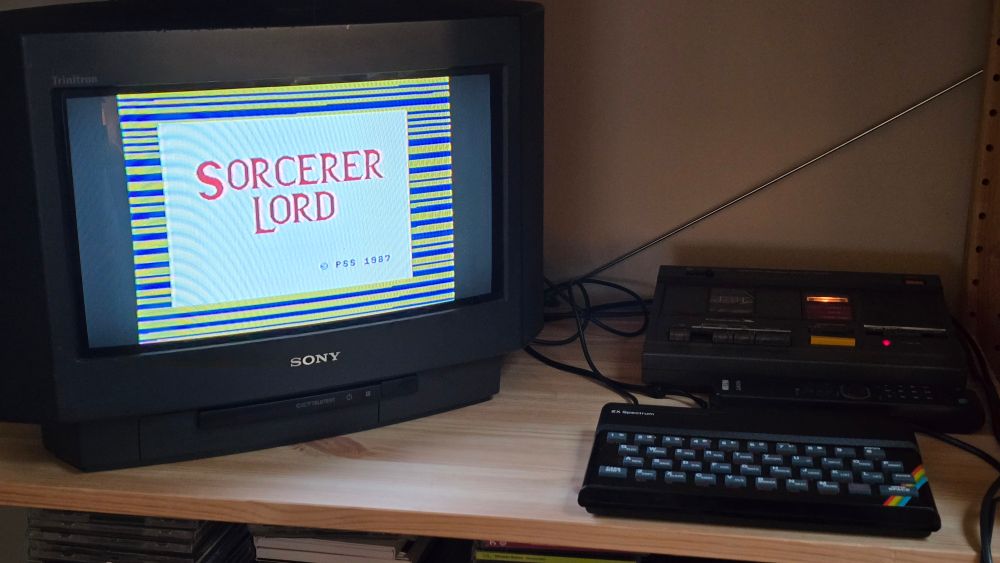 A 48K rubber key ZX Spectrum loading Sorcerer Lord from a WH Smith datacorder, shown on the smallest (I think) Sony widescreen TV.