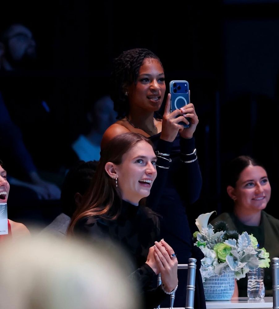 Croix Bethune proudly taking a photo with her iPhone. 