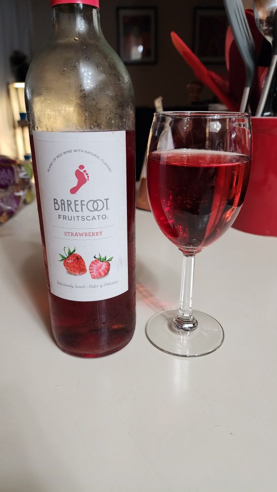 Barefoot vineyards fruitsecco poured in a wine glass after being chilled.