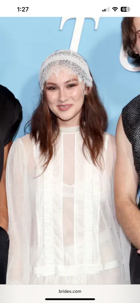 Character who plays Belly Conklin at TSITP premiere wearing white sheer dress & head covering