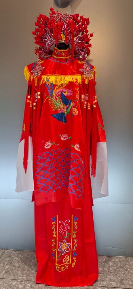 A bright red wedding hanfu with matching headdress