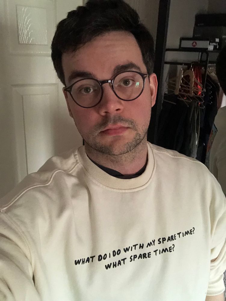 A selfie of me wearing a Kieth Haring inspired jumper from H&M that reads ‘What do I do with my spare time? What spare time’ 