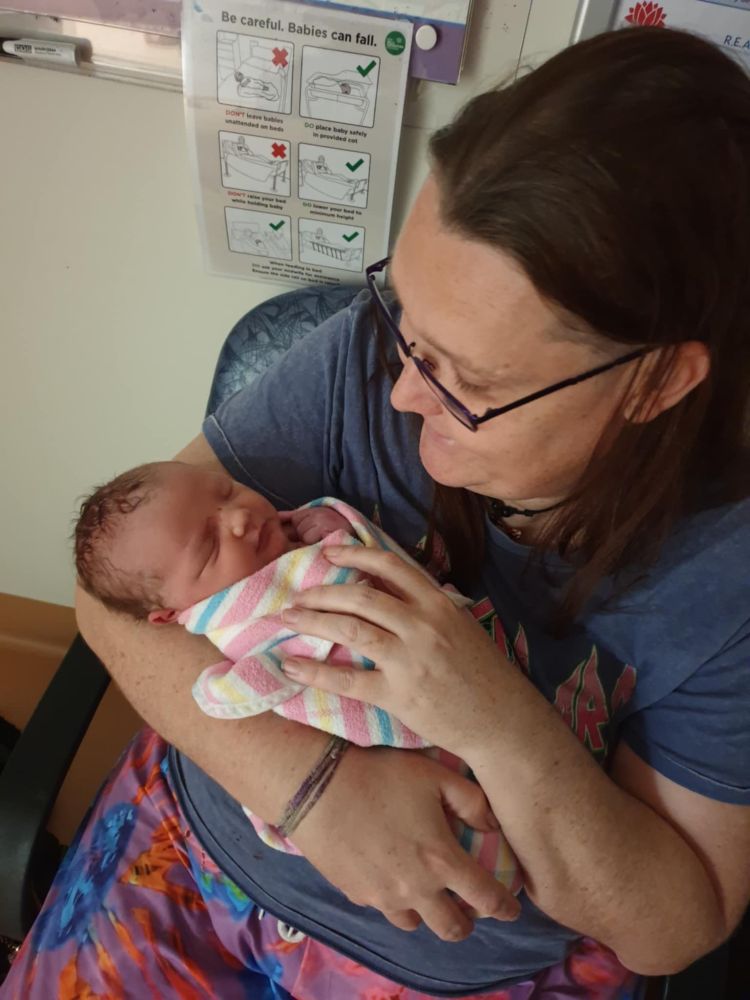 A very proud Moo Ma with their cute as hecc grandson