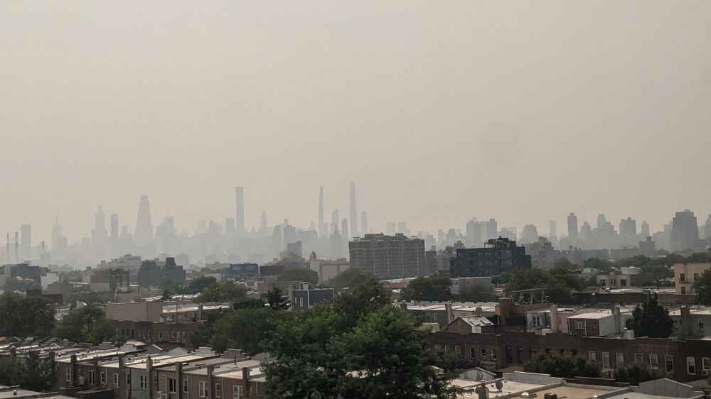 A photo of a city skyline, shrouded in smog