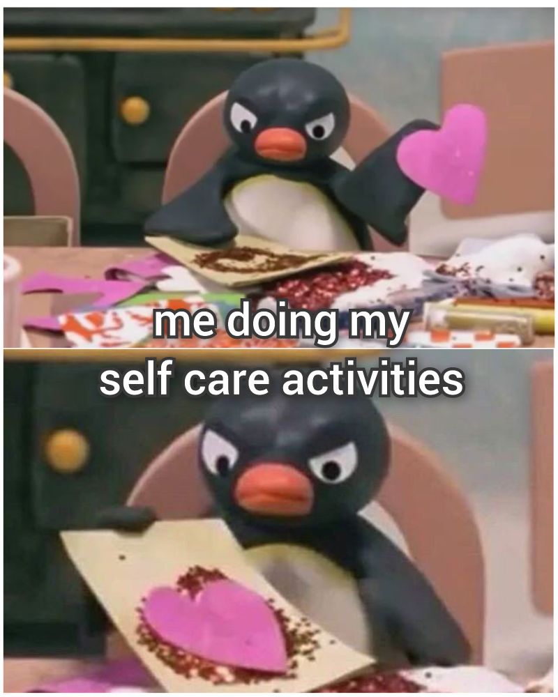 A grumpy and frowning claymation penguin making a sparkly heart card, with the caption "me doing my self care activities"