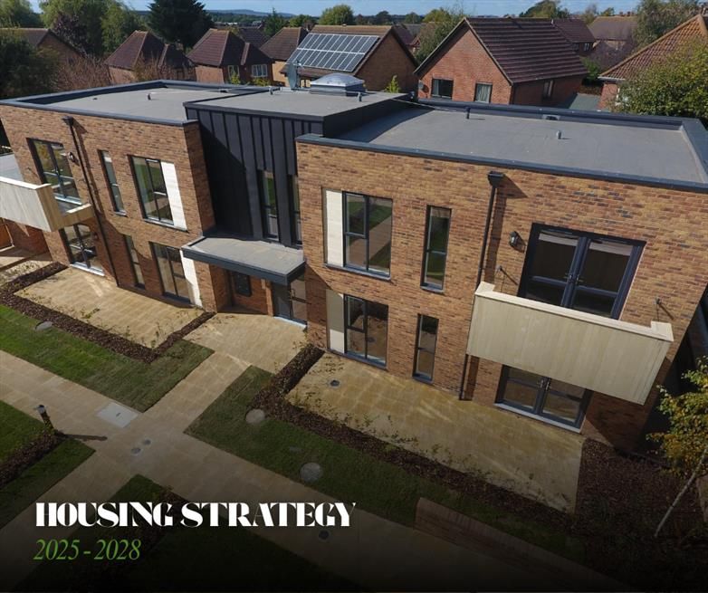 Image shows houses with text that reads: 'Housing Strategy 2025-2028'