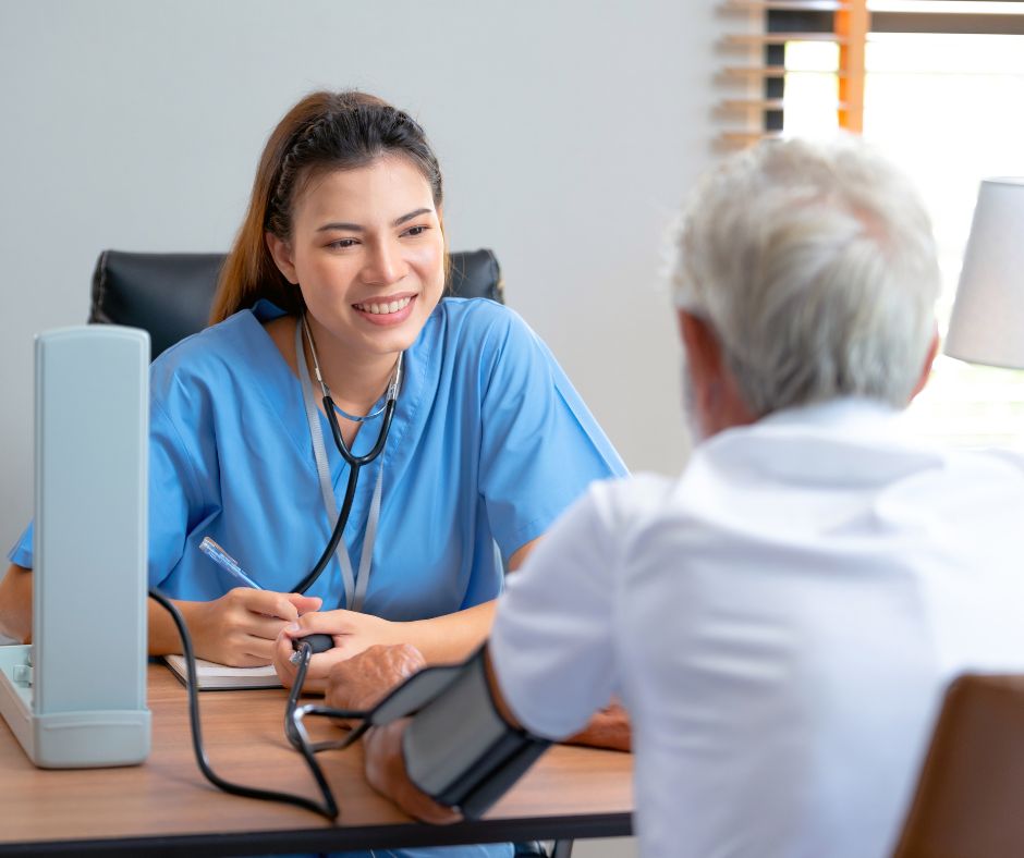 Image shows doctor nurse talking to patient about health checks