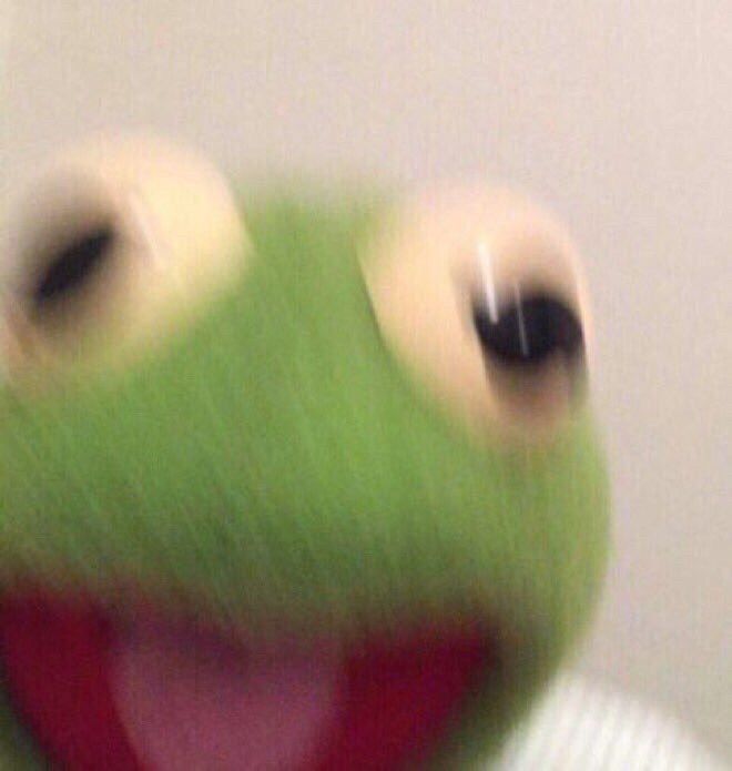 Blurred close-up of Kermit the Frog conveying a sense of surprise or excitement.