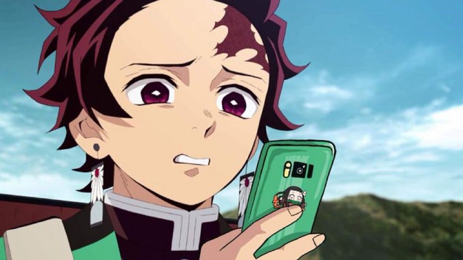 Tanjiro looking at his phone, exceedingly distressed