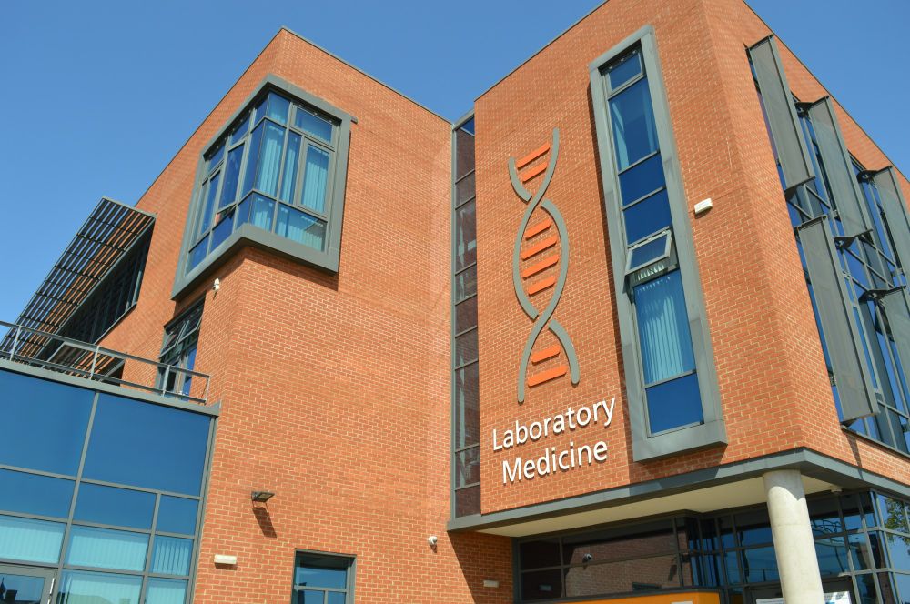 A blue sky is seen behind the Laboratory Medicine building