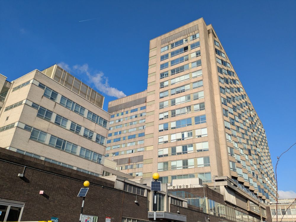 A blue sky is seen behind the Royal Hallamshire Hospital towerblock