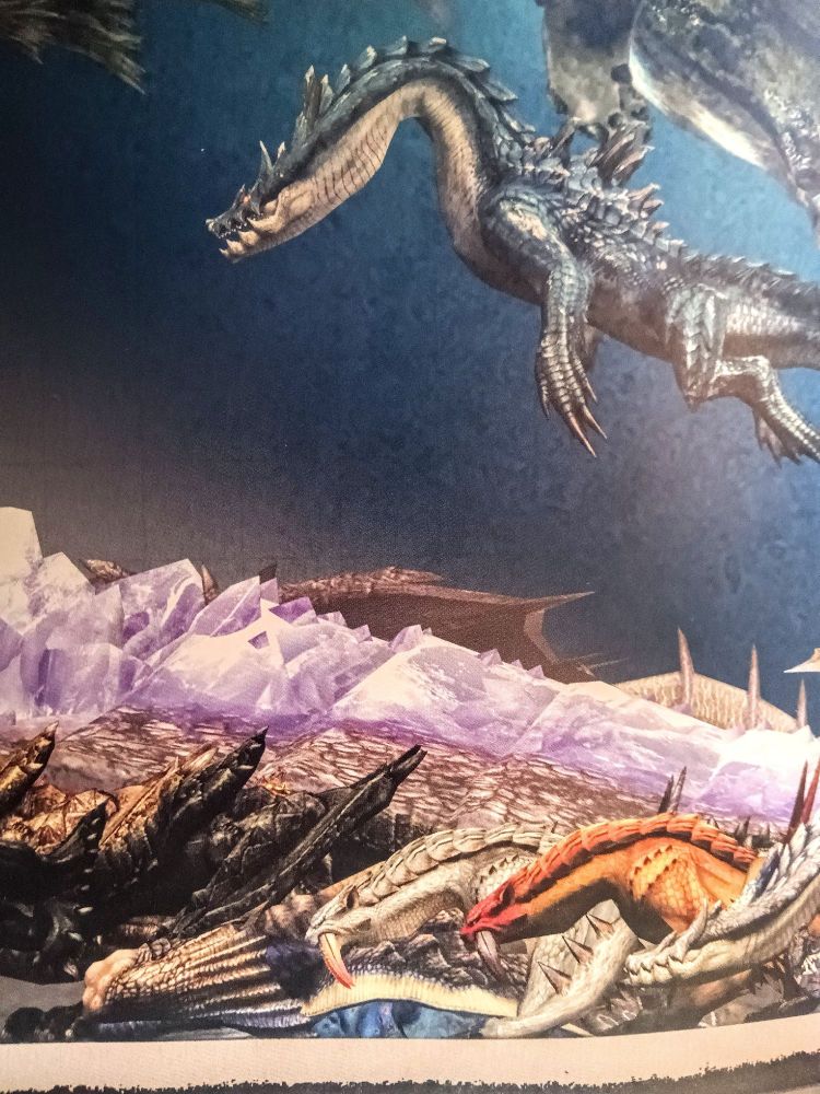 Alatreon wings and horns seen behind Hallowed Jhen Mohran on the Monster Hunter Tri/3G monster size comparison poster