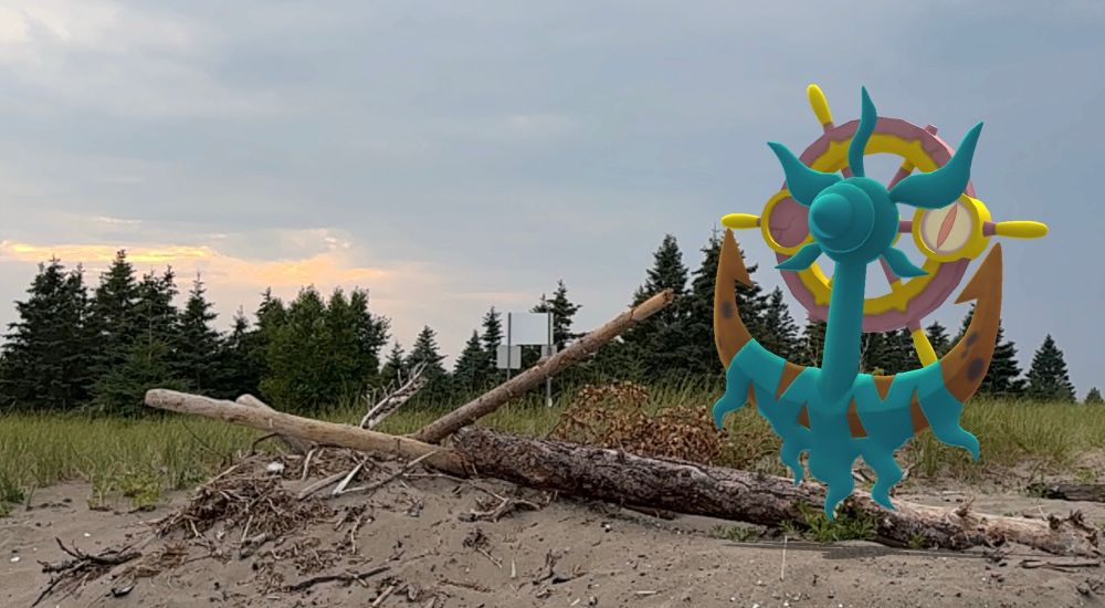 A Dhelmise near a fallen log