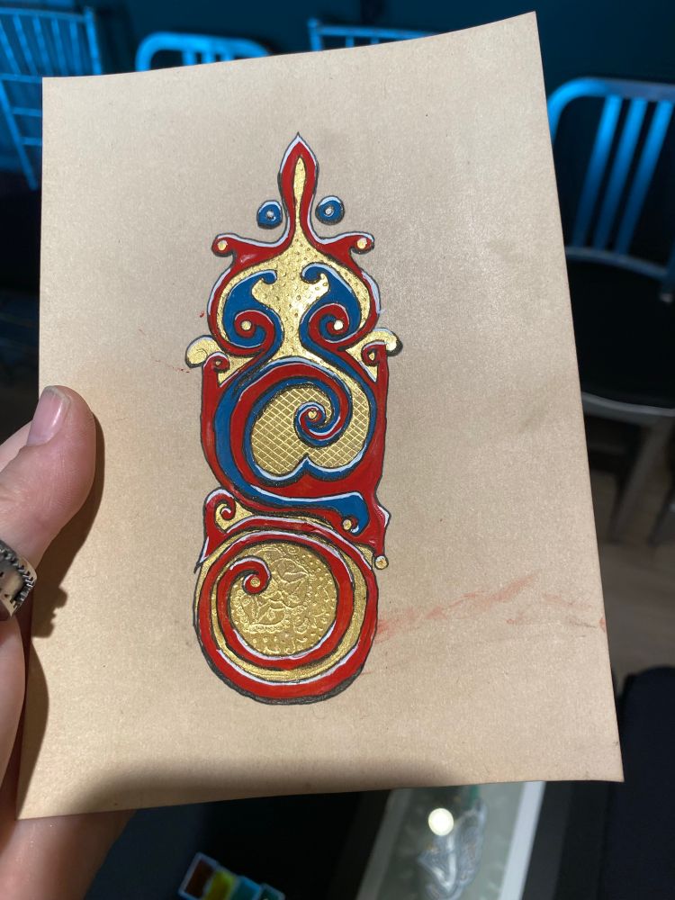 A blue and red stylized swirl design with gleaming shell gold, panels of which are burnished to look like matte gold and shiny gold patterns of a flower, a grid, and polka dots. 