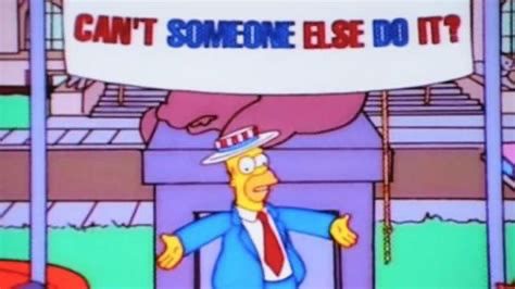 Homer Simpson in front of a sign that reads “Can’t someone else do it?”