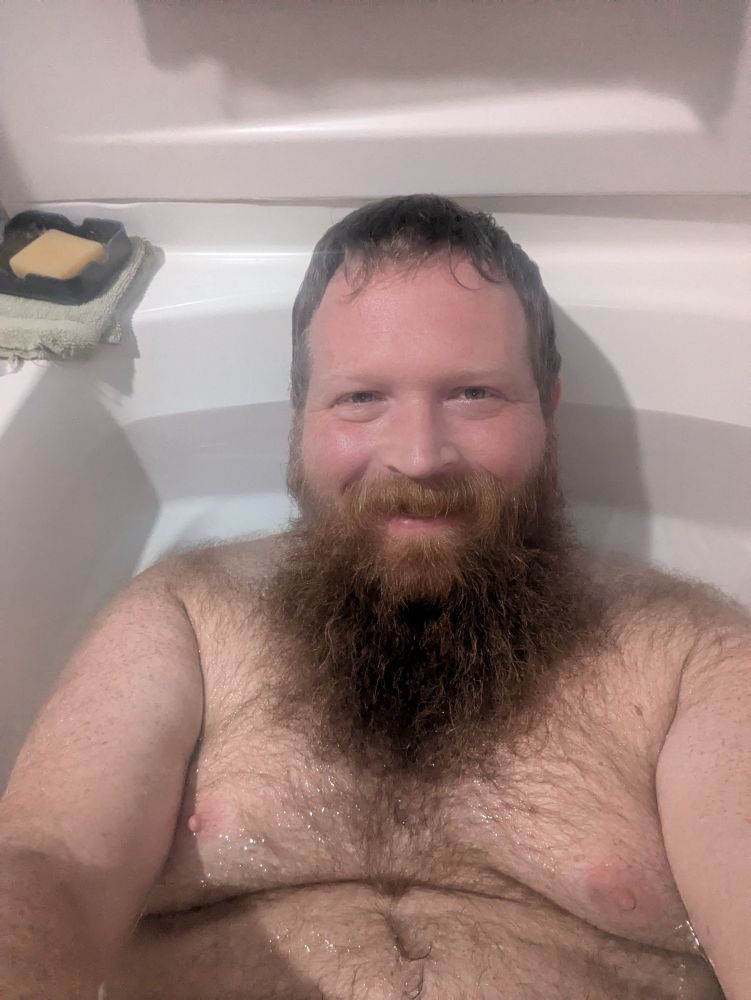 Me in a bathtub soaking in the water