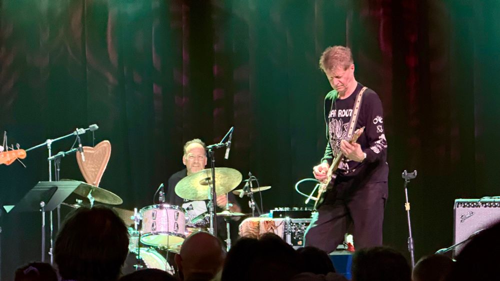 scott amendola playing drums next to nels cline playing guitar 