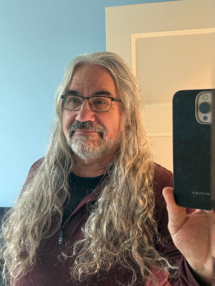 Self portrait with my hair untied and down my chest. 