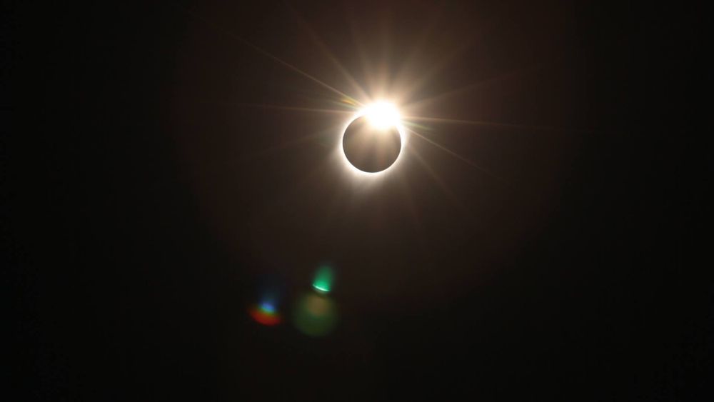 A photo of the total solar eclipse just as totality is ending and the Sun begins to slip from behind the moon