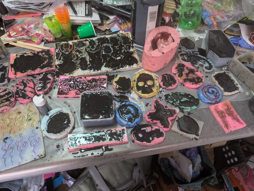 Resin molds filled with holo powder topped with black resin.