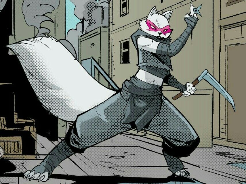 Alopex, a mutant Arctic Fox female, her face mask now red and wearing a more covered black outfit, takes up a fighting stance in an alley. She holds a Ninja star with two fingers in her right hand, the other holding a kama.