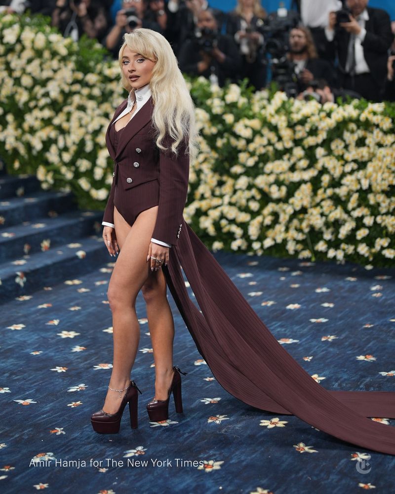 Sabrina Carpenter wears a brown suit with no pants. Photo credit: Amir Hamja for The New York Times.