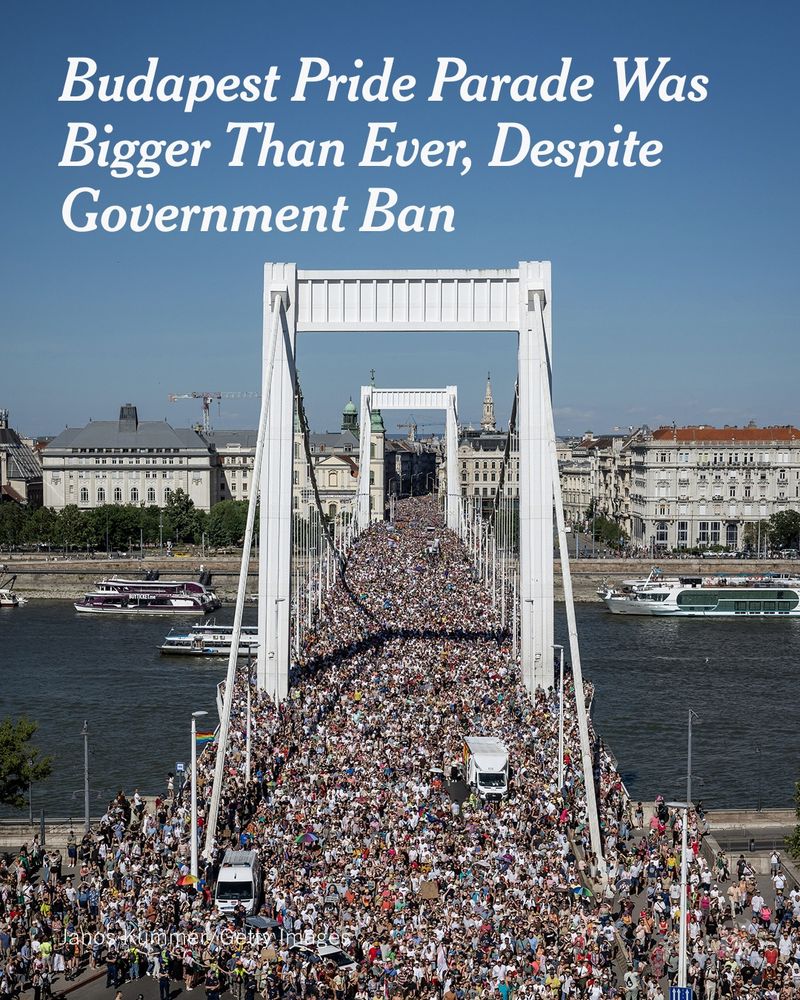 A bridge is packed with people, with scattered pride flags in the crowd. A headline reads: "Budapest Pride Parade Was Bigger Than Ever, Despite Government Ban." Photo by Janos Kummer/Getty Images.