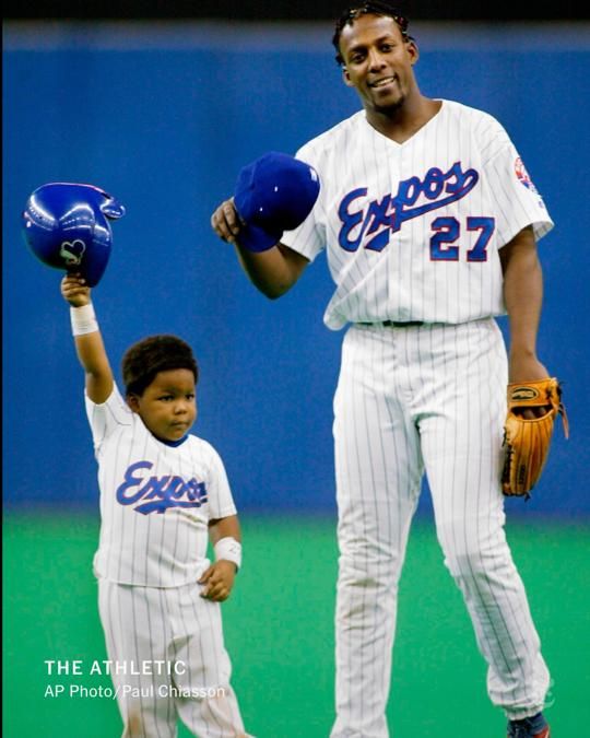 Vladimir Guerrero Jr., then 3, with his father in 2003.