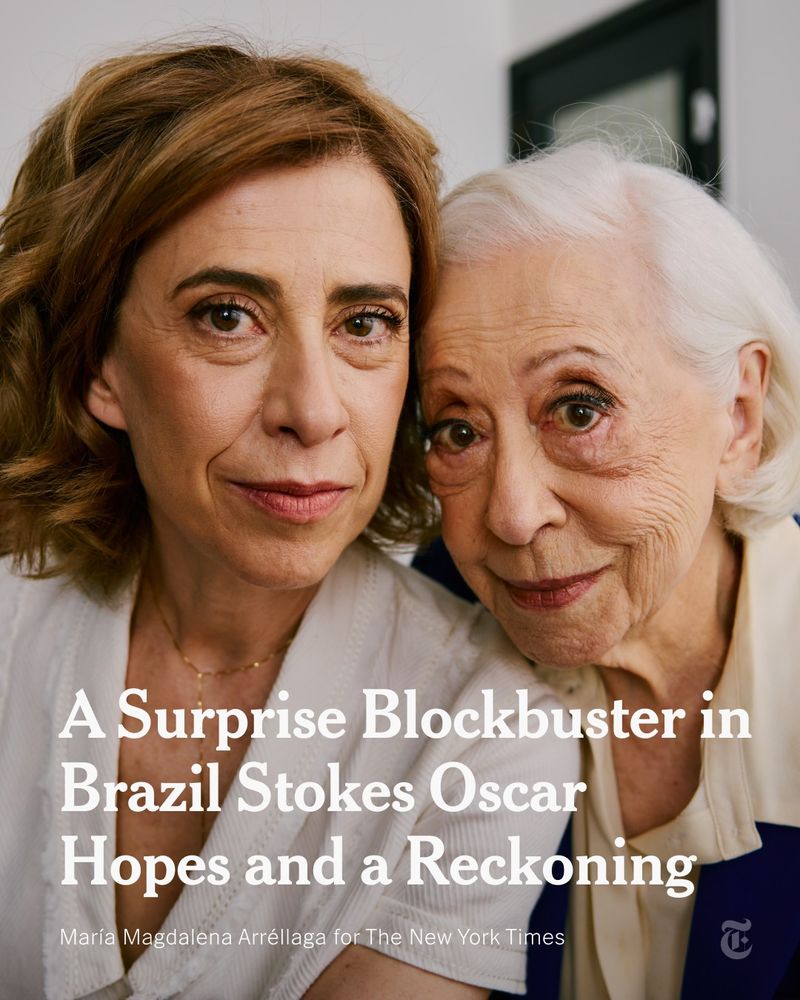 Fernanda Torres and her mother, Fernanda Montenegro, are posing for a photo, sitting close together and looking straight into the camera. A headline reads: "A Surprise Blockbuster in Brazil Stokes Oscar Hopes and a Reckoning." Photo by María Magdalena Arréllaga for The New York Times.