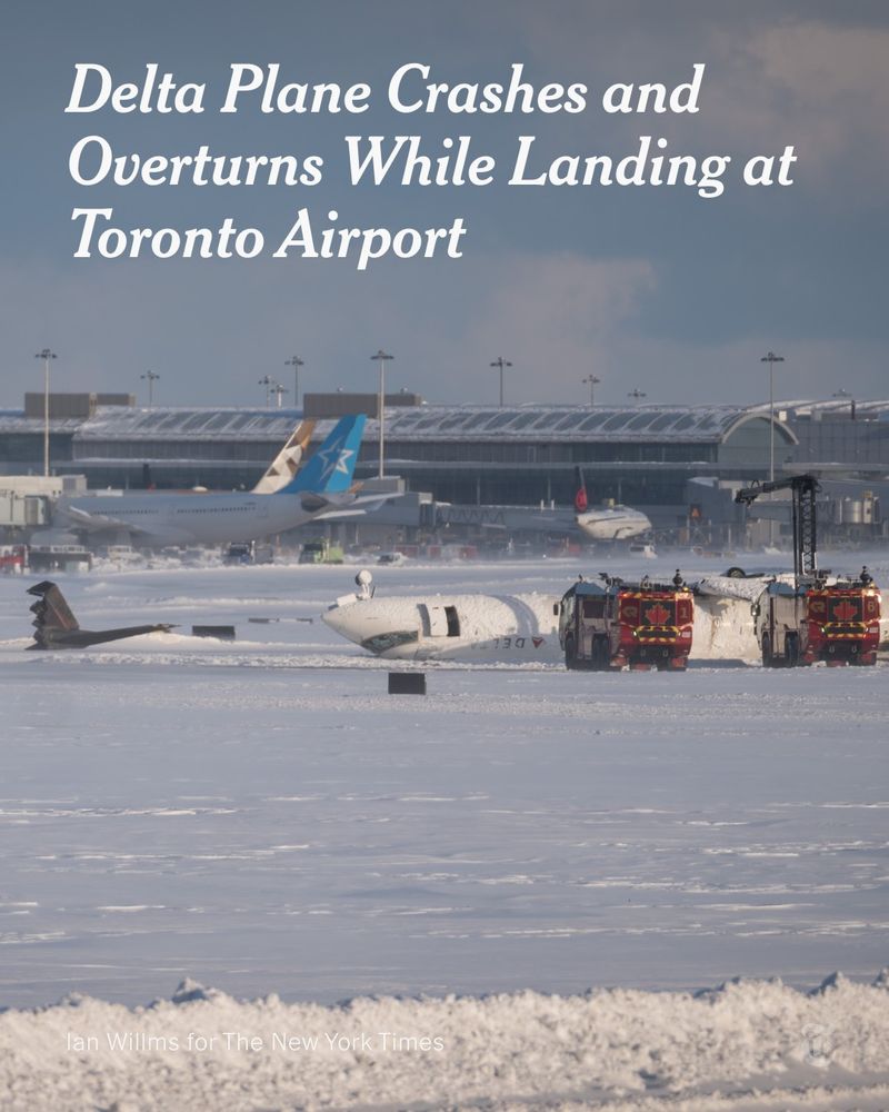 Emergency responders at the site of a plane turned upside down and damaged on a snowy runway. A headline reads: Delta Plane Crashes and Overturns While Landing at Toronto Airport. Photo by Ian Willms for The New York Times.
