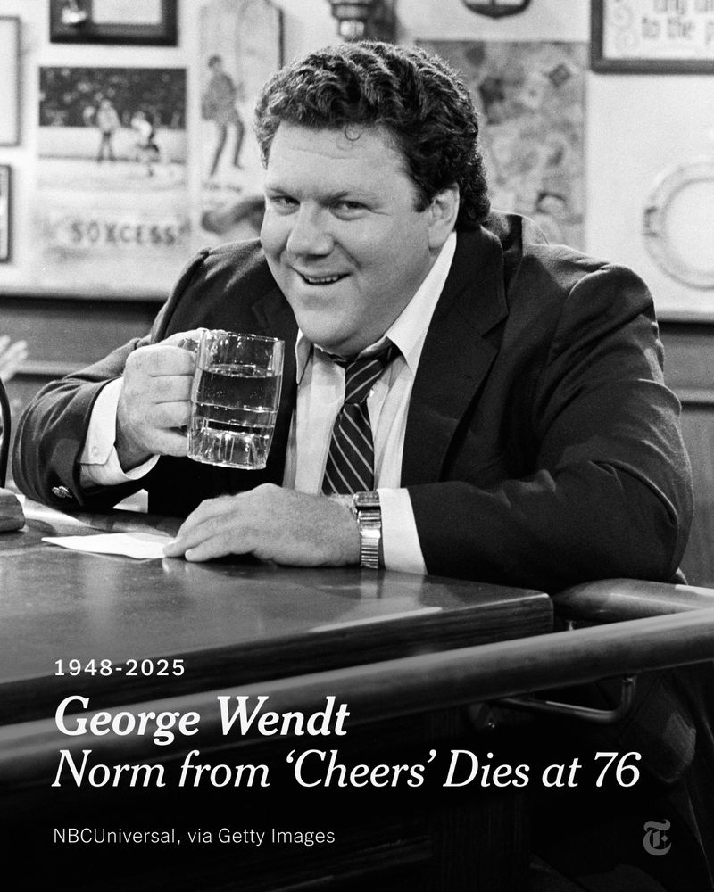 George Wendt holding a glass mug and smiling. A headline reads: “George Wendt, Norm from 'Cheers’, Dies at 76.” Photo credit: NBCUniversal, via Getty Images.