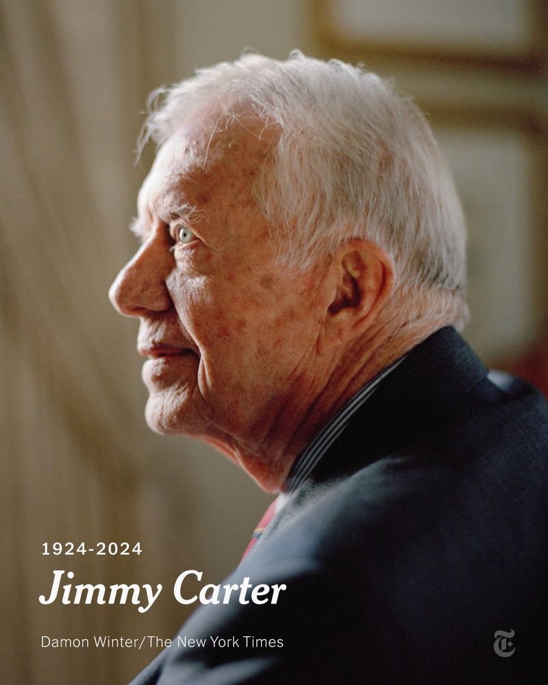 A portrait photo of Jimmy Carter smiling and looking to his left. A headline reads: "1924-2024: Jimmy Carter." Photo by Damon Winter/The New York Times.