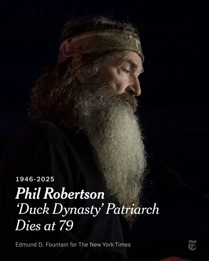 A man with a long white beard. Text reads: "1946-2025. Phil Robertson ‘Duck Dynasty’ Patriarch Dies at 79." Photo credit: Edmund D. Fountain for The New York Times